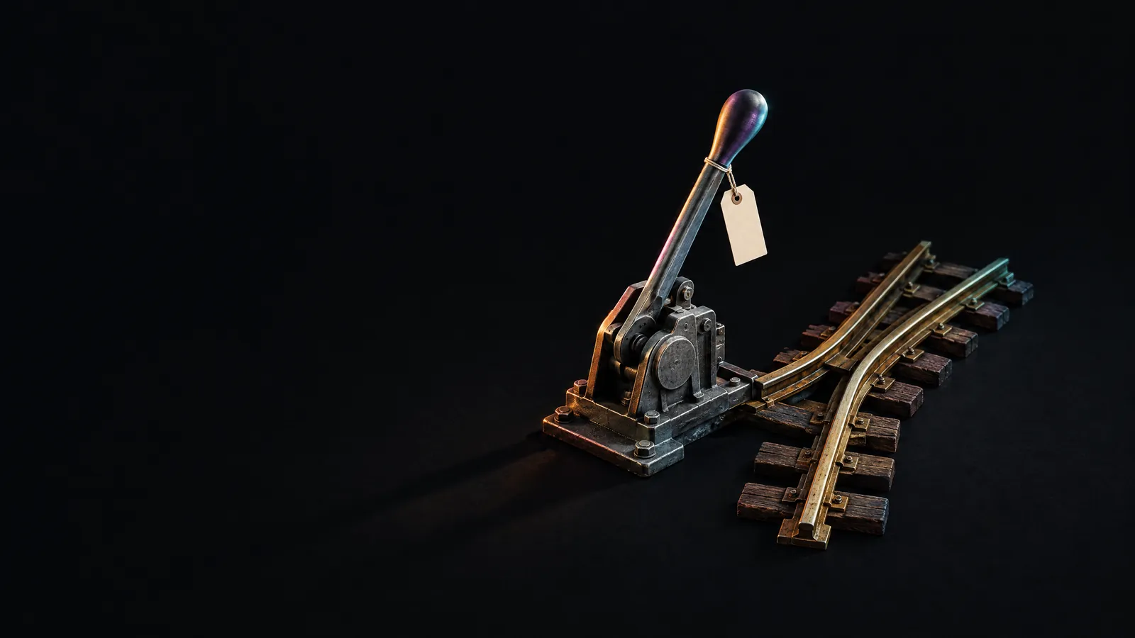 A steel points lever dividing a brass track in two, for routing each revenue signal to the right place.